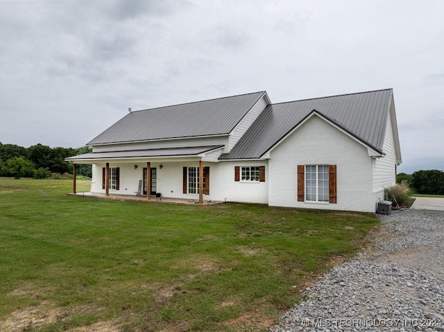 view of front of house with a front lawn and a porch