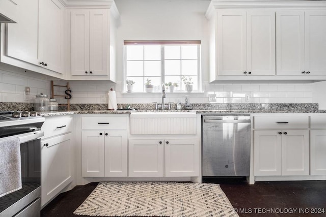 kitchen featuring stone counters, white cabinets, sink, stainless steel appliances, and extractor fan