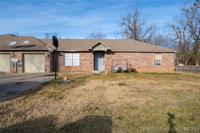 ranch-style home with a garage and a front yard