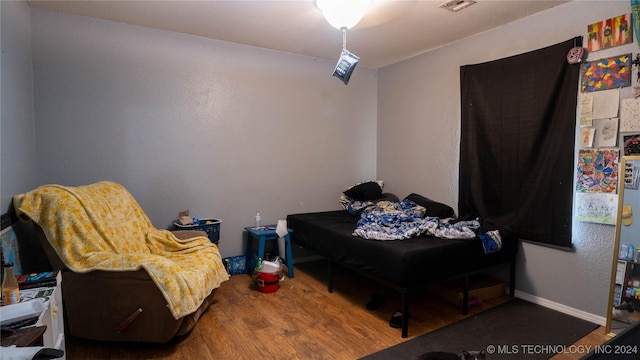 bedroom featuring hardwood / wood-style floors