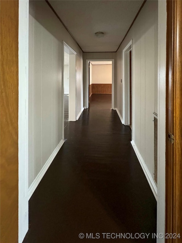 corridor with dark wood-type flooring