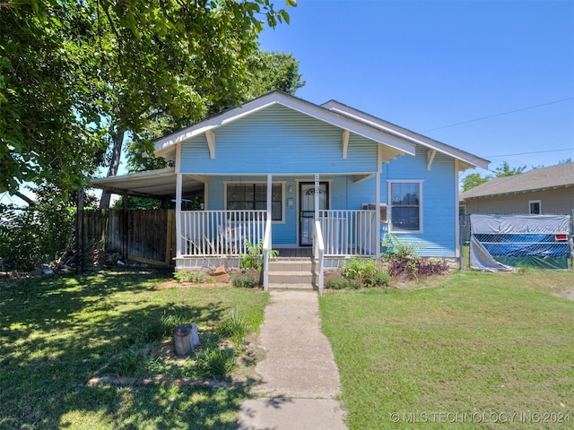 view of front of home featuring a porch and a front yard