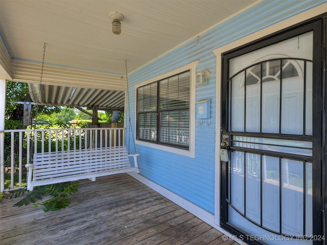 doorway to property featuring covered porch