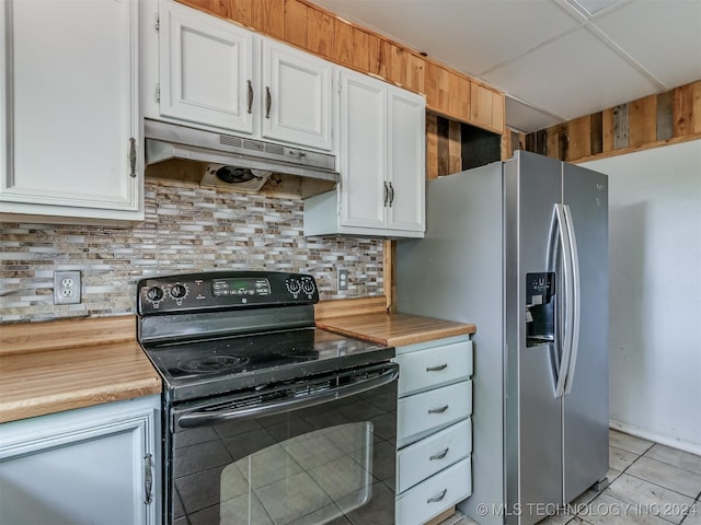 kitchen featuring stainless steel fridge, tasteful backsplash, electric range, white cabinets, and light tile patterned flooring