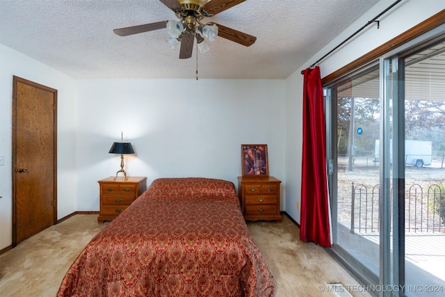 bedroom featuring access to exterior, ceiling fan, light colored carpet, and a textured ceiling