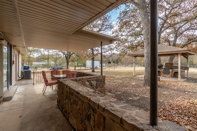 view of patio / terrace with cooling unit and exterior kitchen