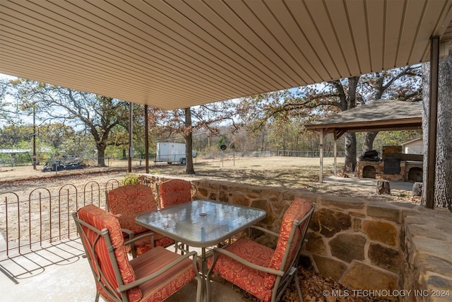 view of patio / terrace featuring a gazebo and an outdoor kitchen