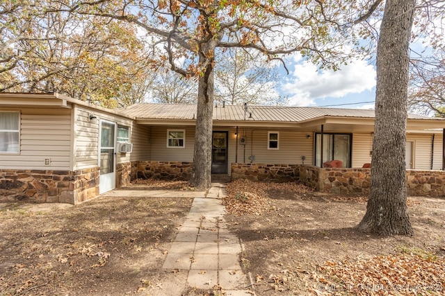 ranch-style home featuring cooling unit