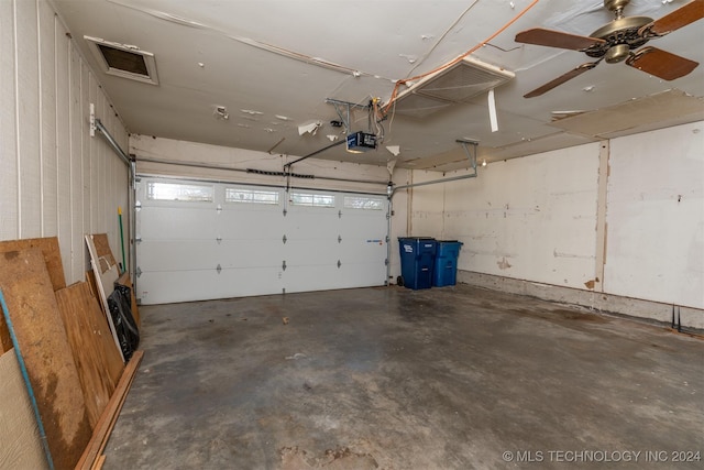 garage with ceiling fan and a garage door opener