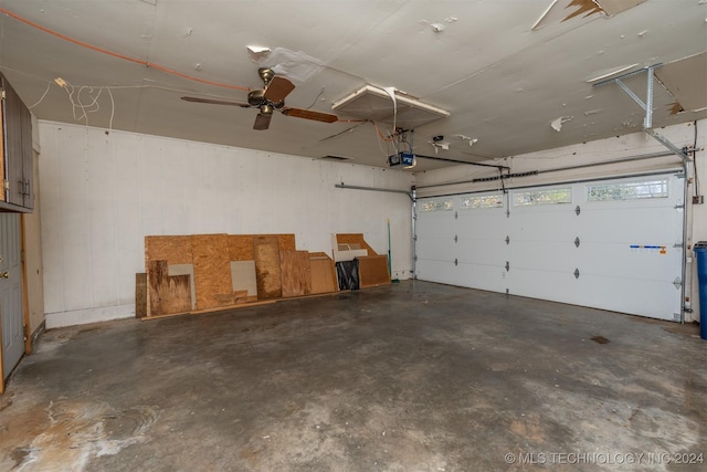 garage featuring ceiling fan and a garage door opener