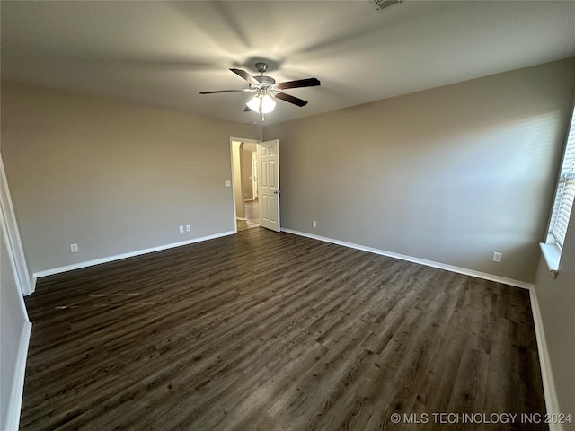 unfurnished room featuring ceiling fan and dark hardwood / wood-style flooring