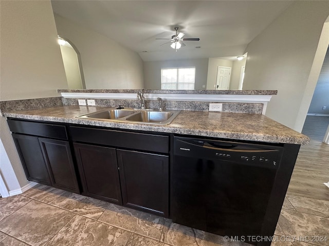 kitchen featuring sink, vaulted ceiling, ceiling fan, black dishwasher, and kitchen peninsula