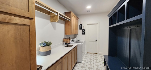 mudroom with washer and dryer