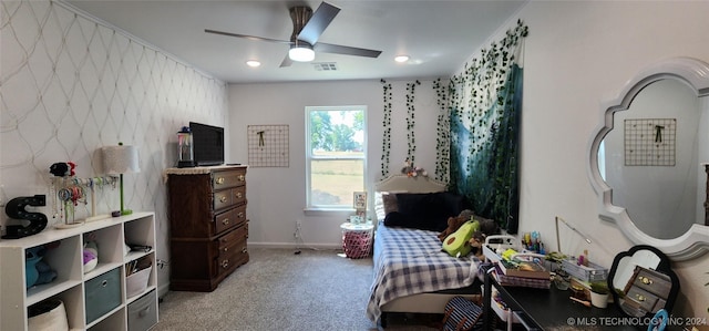 bedroom featuring ceiling fan and light carpet