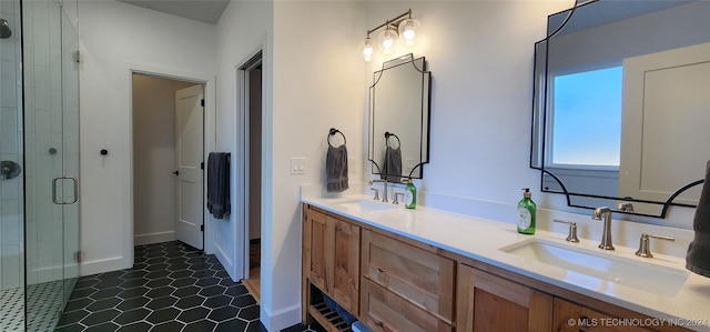 bathroom featuring vanity and a shower with door