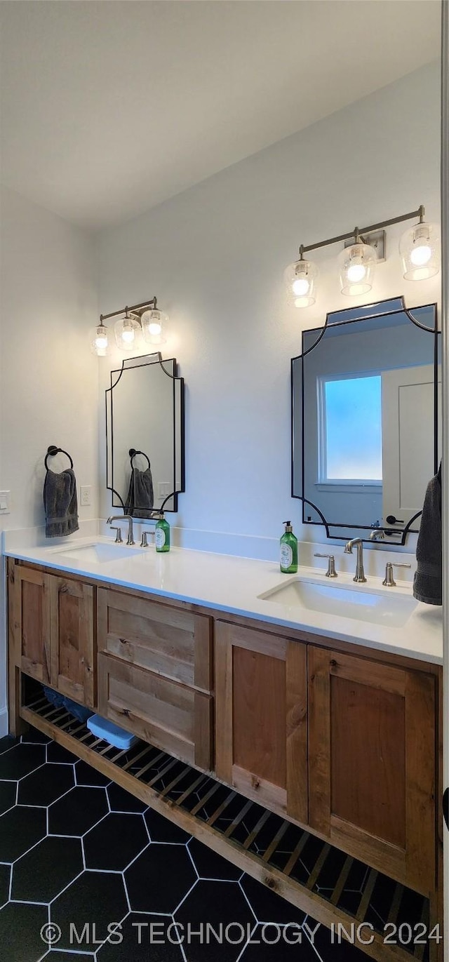 bathroom featuring tile patterned flooring and vanity