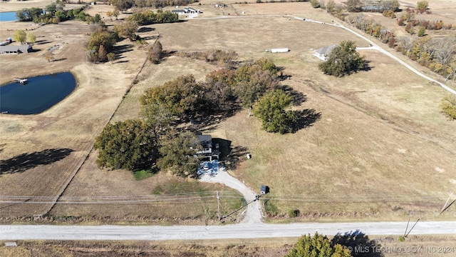 drone / aerial view featuring a rural view and a water view