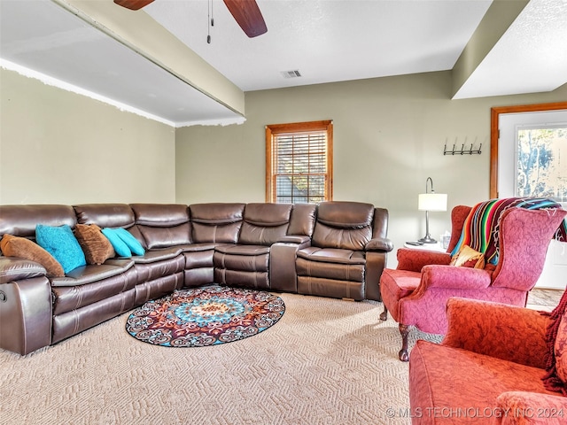 living room with ceiling fan and carpet floors