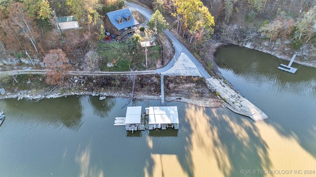 birds eye view of property featuring a water view