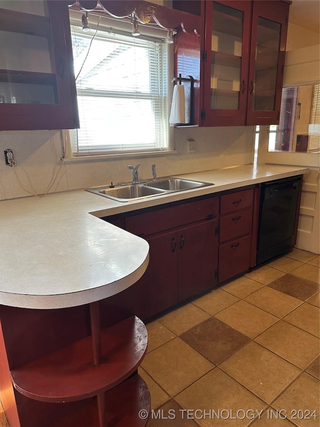 kitchen with sink, light tile patterned floors, and dishwasher