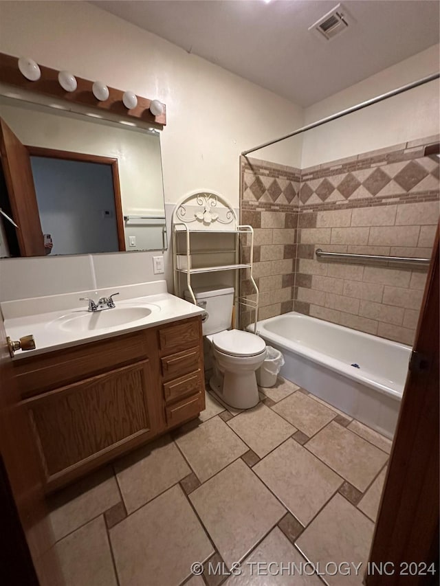 full bathroom featuring vanity, toilet, and tiled shower / bath combo