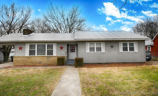 single story home with a front lawn and a carport