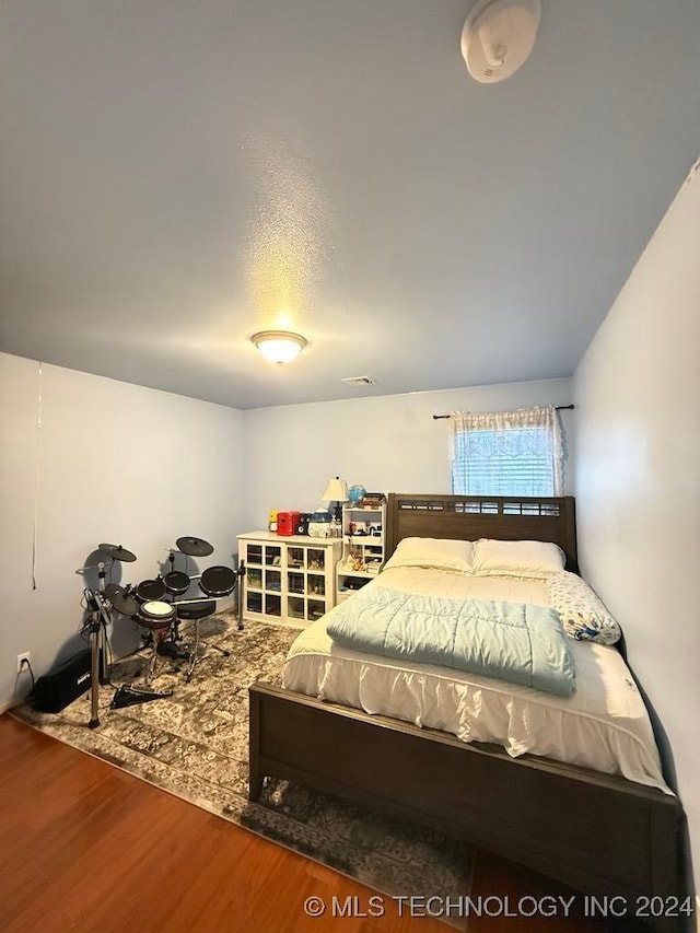 bedroom featuring hardwood / wood-style flooring