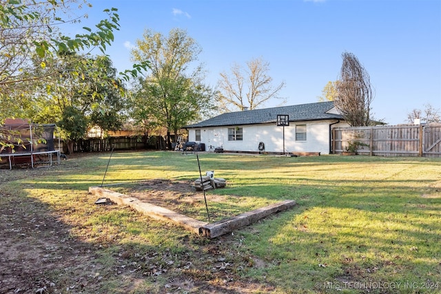 view of yard featuring a trampoline