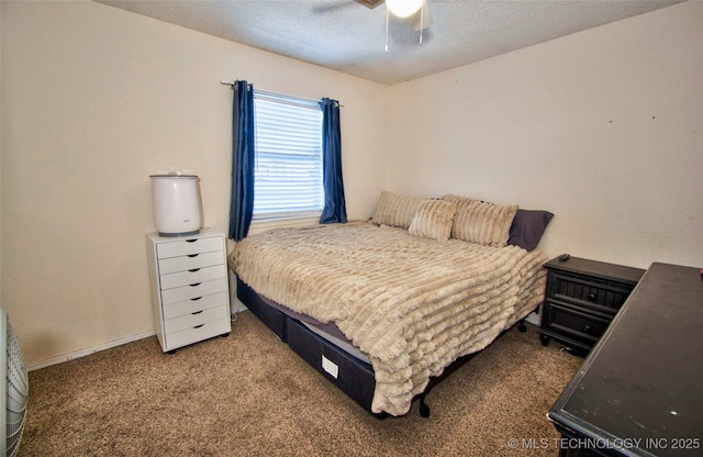 bedroom featuring a textured ceiling, carpet floors, and ceiling fan