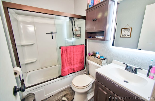 full bathroom with toilet, vanity, and combined bath / shower with glass door