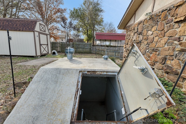 entry to storm shelter featuring a storage unit