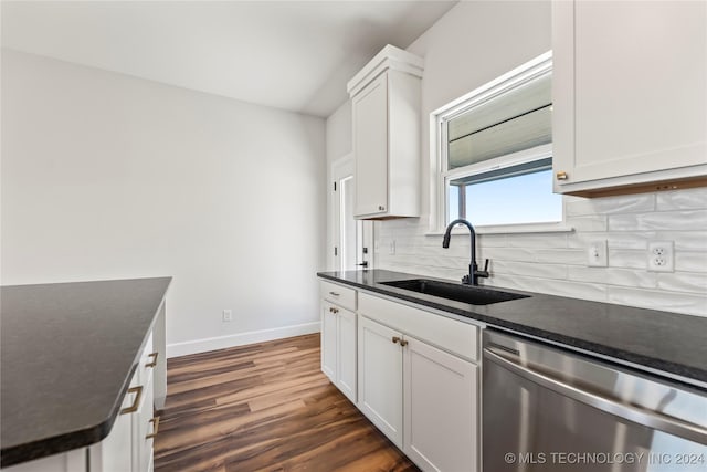 kitchen with dishwasher, white cabinets, and sink