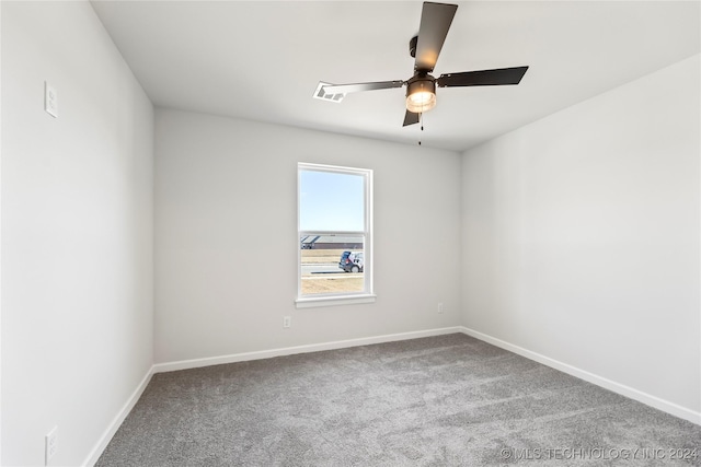 unfurnished room with ceiling fan and carpet floors