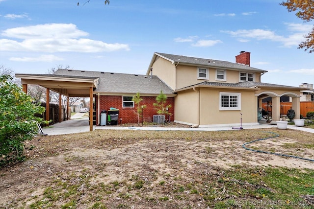 rear view of property featuring a patio area and central air condition unit