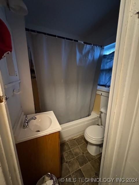 full bathroom with tile patterned flooring, vanity, toilet, and shower / tub combo