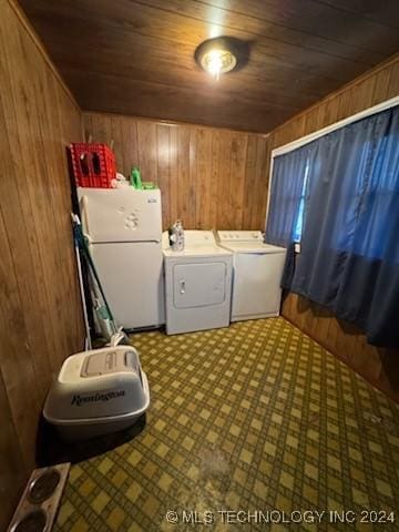 laundry area featuring separate washer and dryer, wooden walls, and wood ceiling