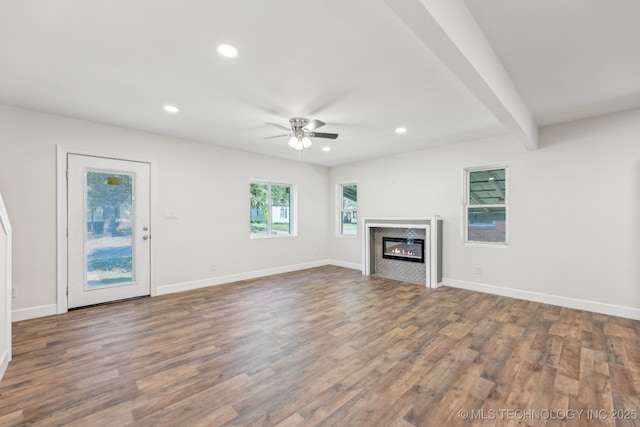 1006 N K St, Muskogee, OK 74403 - unfurnished living room with recessed lighting, a ceiling fan, wood finished floors, and a glass covered fireplace