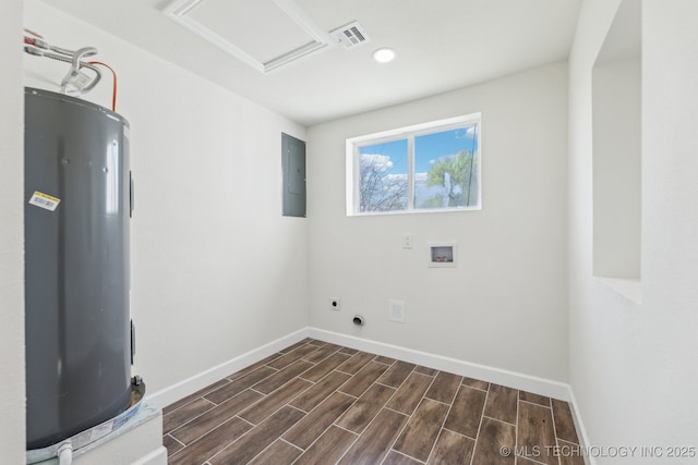 1006 N K St, Muskogee, OK 74403 - washroom with water heater, hookup for an electric dryer, attic access, dark wood finished floors, and washer hookup