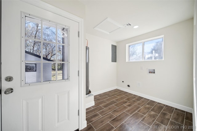 laundry area featuring electric panel, hookup for a washing machine, a healthy amount of sunlight, and dark hardwood / wood-style floors