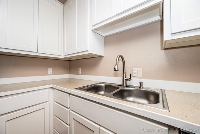 kitchen with white cabinets and sink