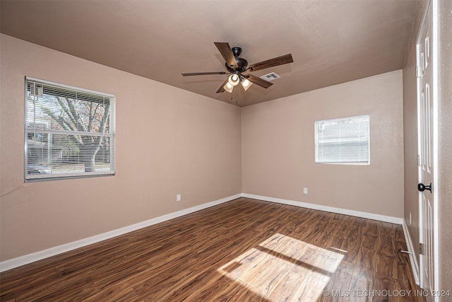 unfurnished room featuring ceiling fan and dark hardwood / wood-style floors