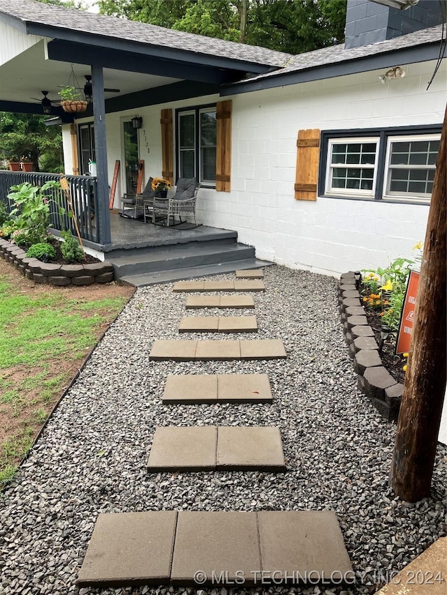 back of house featuring a porch