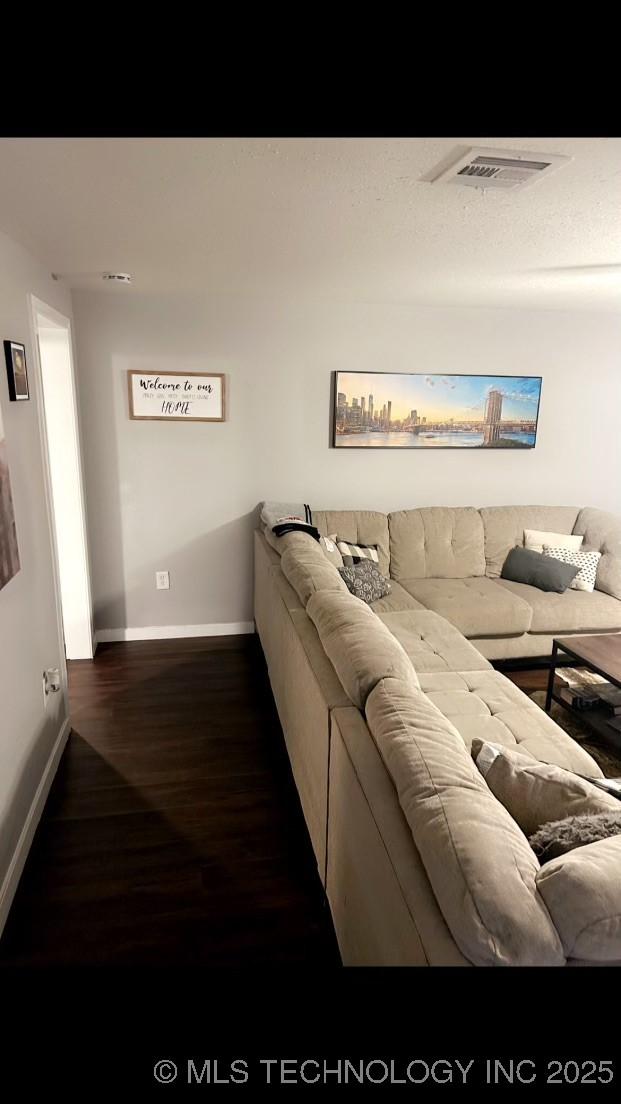 living room featuring dark hardwood / wood-style flooring