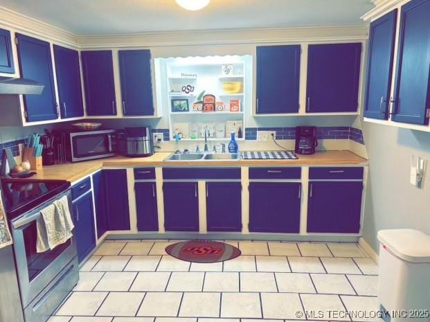 kitchen featuring appliances with stainless steel finishes, blue cabinets, extractor fan, and sink