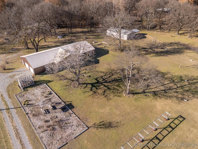 birds eye view of property with a rural view