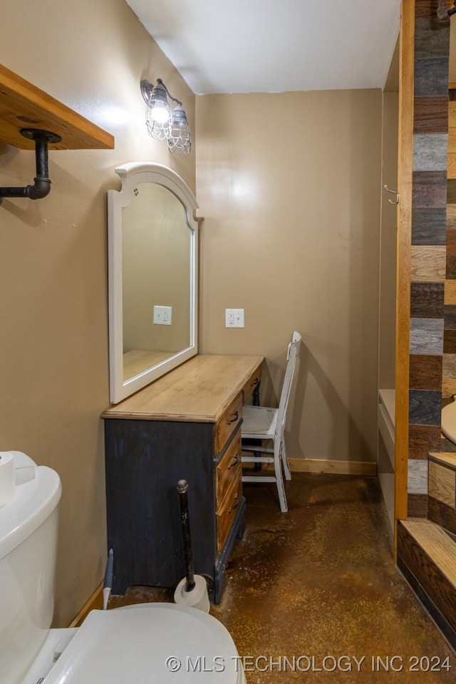 bathroom featuring toilet and concrete floors