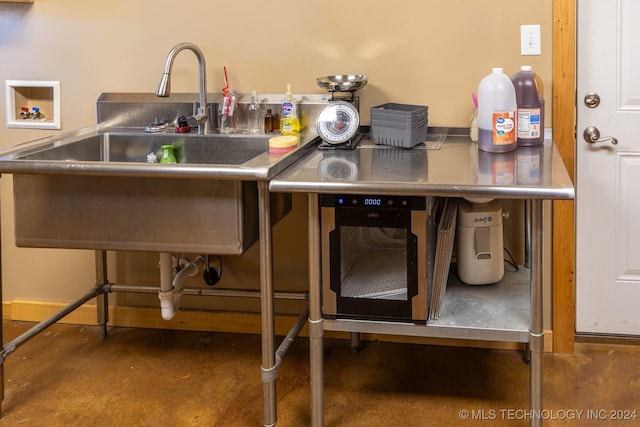 kitchen featuring stainless steel counters and sink