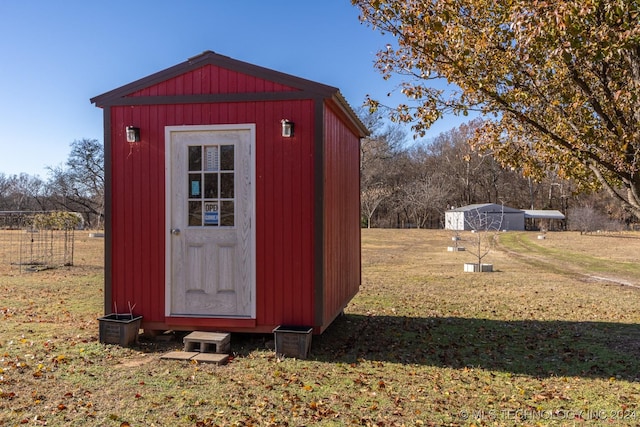 view of outbuilding with a lawn