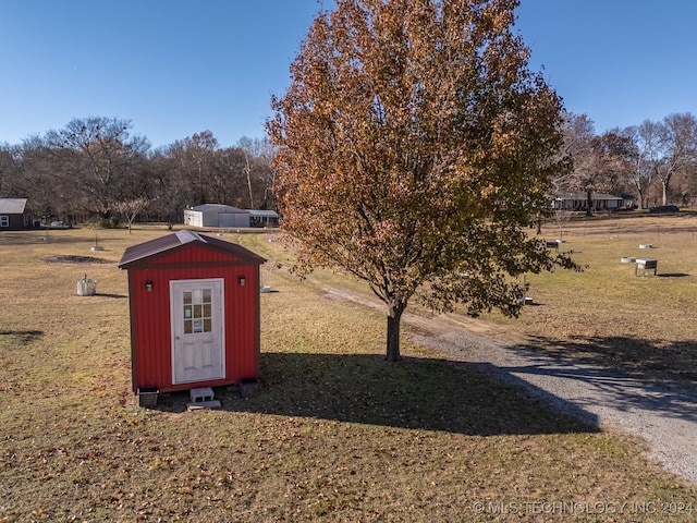 view of outdoor structure with a lawn