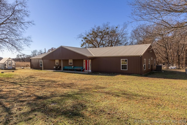 exterior space with a yard and central AC unit